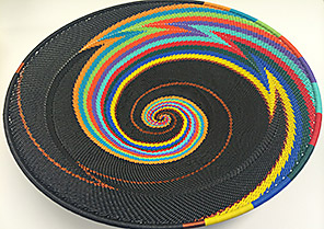 Wireless Innovation Project winners’ trophy: colorful basket woven from phone wire